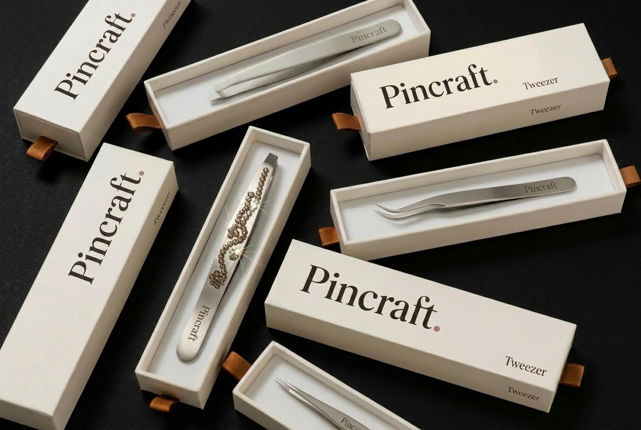 Pincraft retail boxes open showing tweezers inside